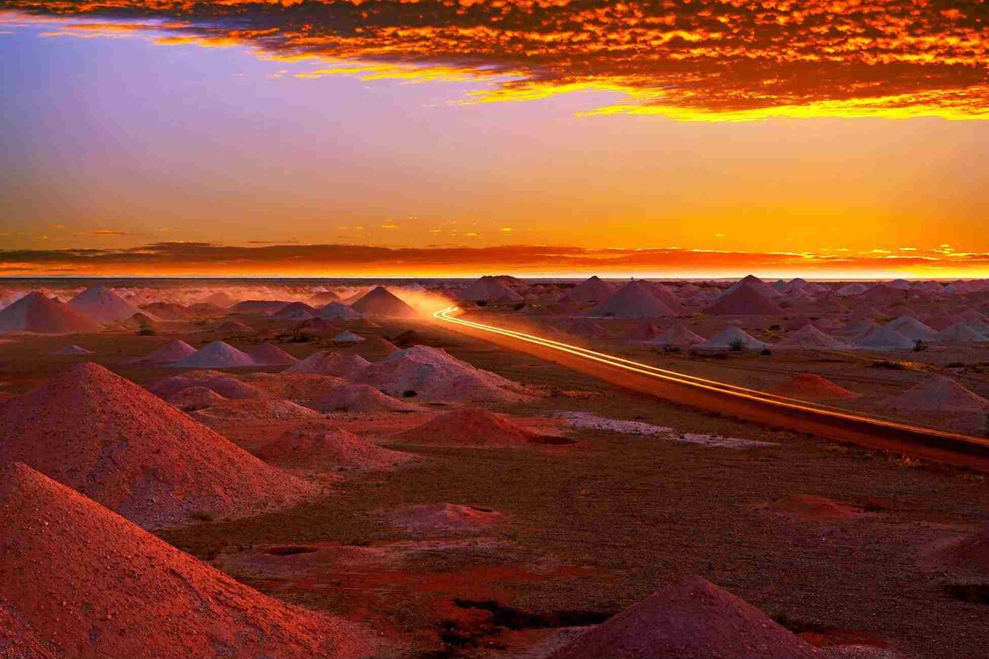 Stunning sunset view over Coober Pedy opal mine fields in Australia. | Elite Rail Journey